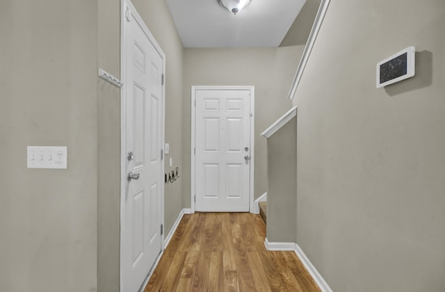 corridor with light wood-type flooring