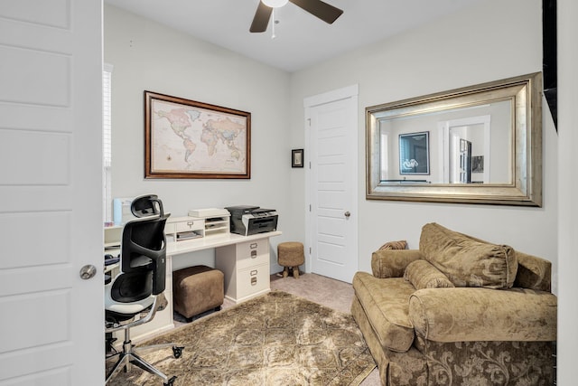 carpeted office with ceiling fan