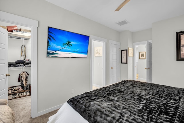 carpeted bedroom with ceiling fan