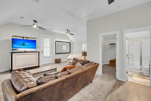 living room with lofted ceiling and light hardwood / wood-style flooring