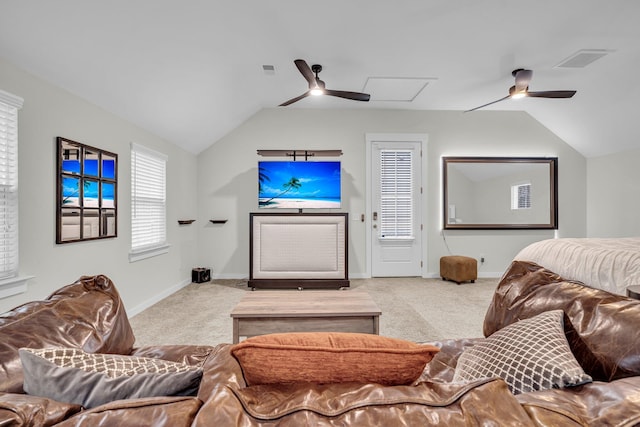 living room with vaulted ceiling, light colored carpet, and ceiling fan