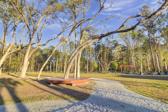 view of property's community featuring a yard