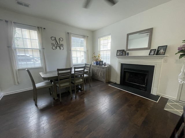 1418 Whispering Oak Trl, Mount Pleasant, SC 29466 - dining area featuring dark wood-style floors, ceiling fan, a fireplace with flush hearth, and baseboards