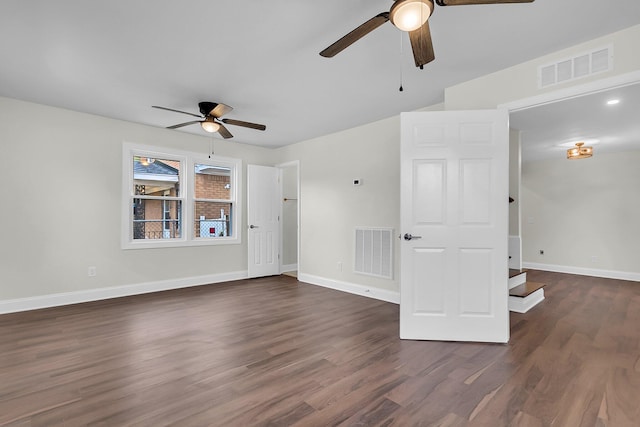 spare room featuring ceiling fan and dark hardwood / wood-style floors