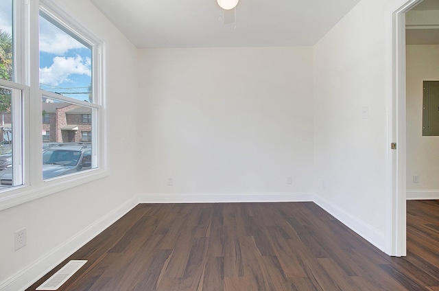 empty room with dark wood-type flooring