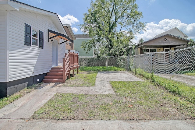 view of yard featuring a wooden deck