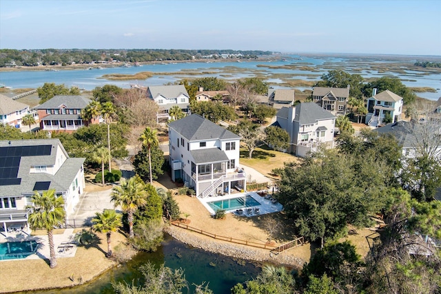 aerial view featuring a residential view and a water view