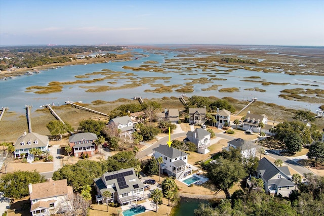 bird's eye view featuring a water view and a residential view