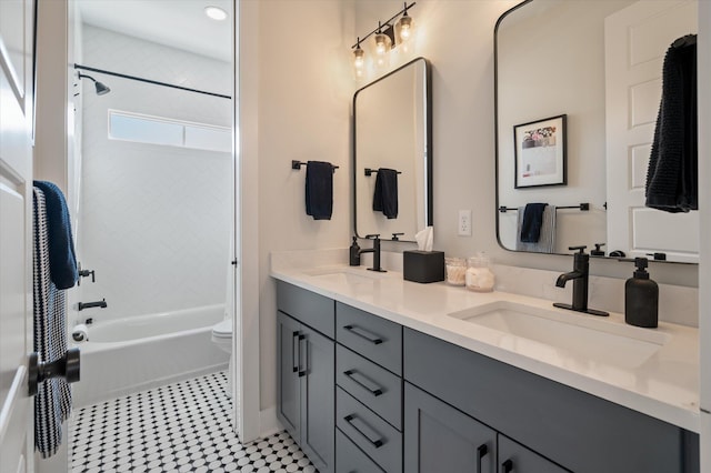 bathroom with double vanity, a sink, and shower / tub combination