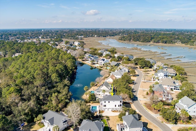 birds eye view of property with a water view and a residential view