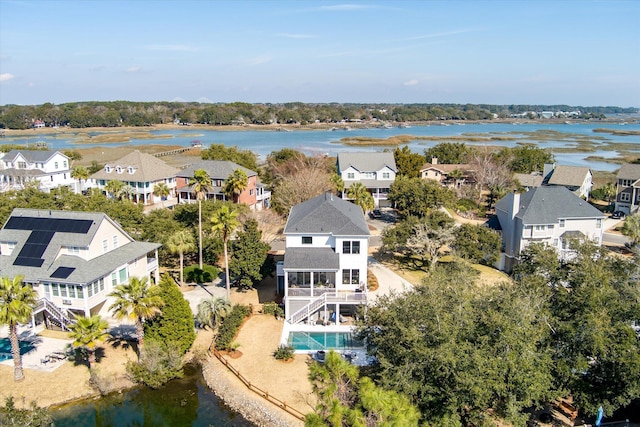 bird's eye view featuring a water view and a residential view