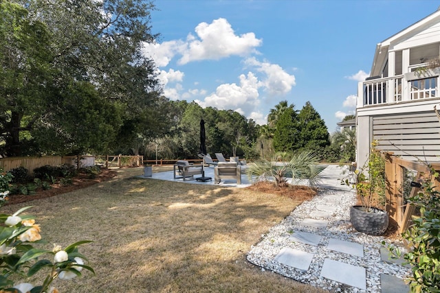 view of yard featuring a patio and fence