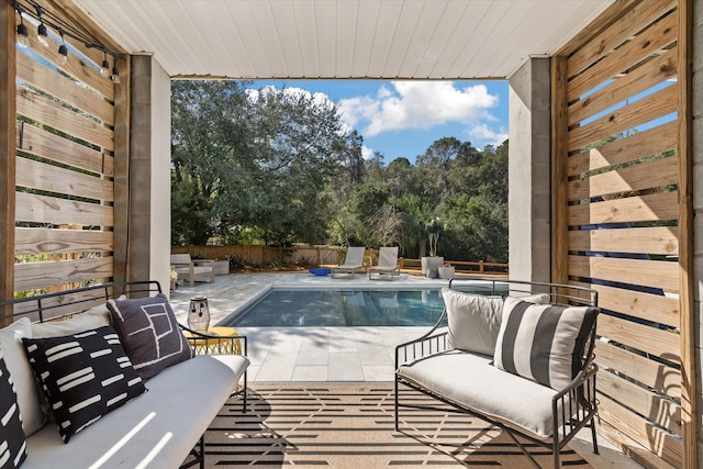 exterior space featuring a patio, a fenced backyard, and a fenced in pool