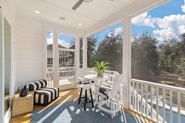 sunroom / solarium with ceiling fan