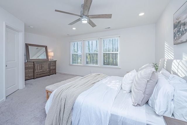 carpeted bedroom with ceiling fan