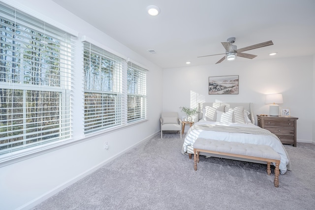 bedroom with ceiling fan and carpet floors