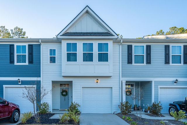 townhome / multi-family property featuring a garage