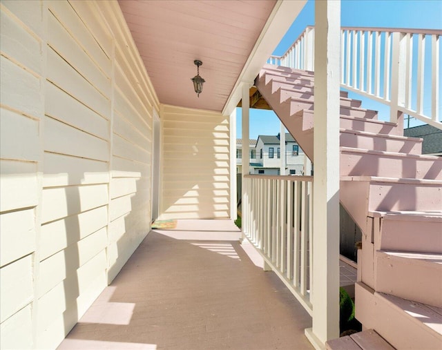 view of exterior entry featuring covered porch