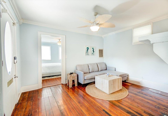 living room featuring ceiling fan, dark hardwood / wood-style flooring, and crown molding