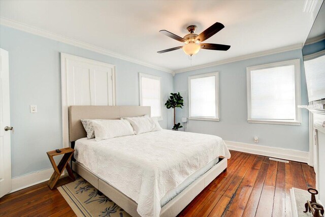 bedroom with ceiling fan, crown molding, and hardwood / wood-style flooring