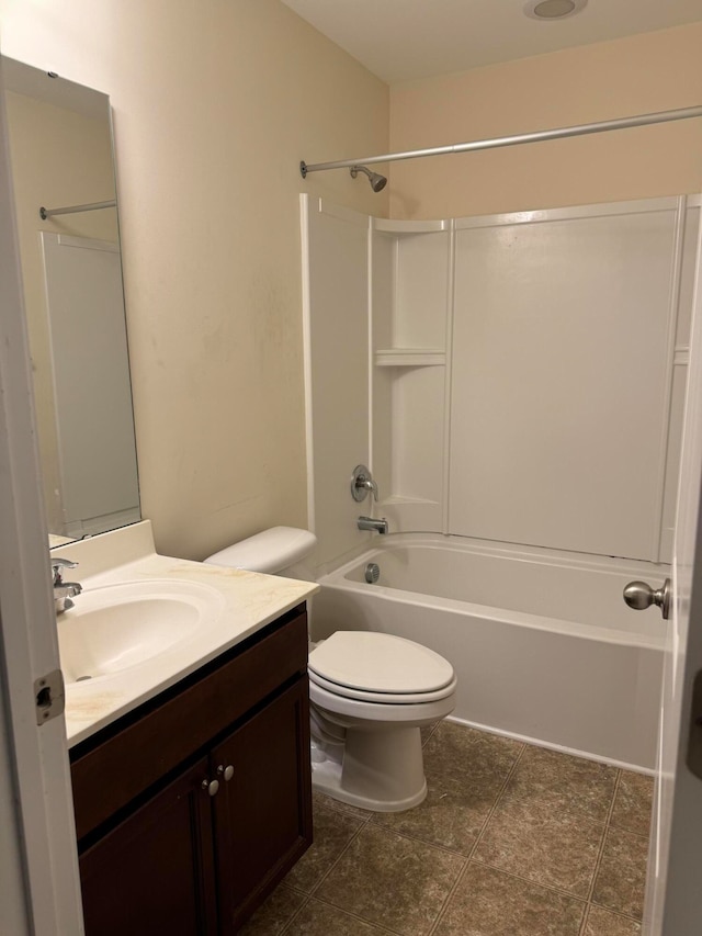 full bathroom featuring tile patterned flooring, shower / bathing tub combination, vanity, and toilet