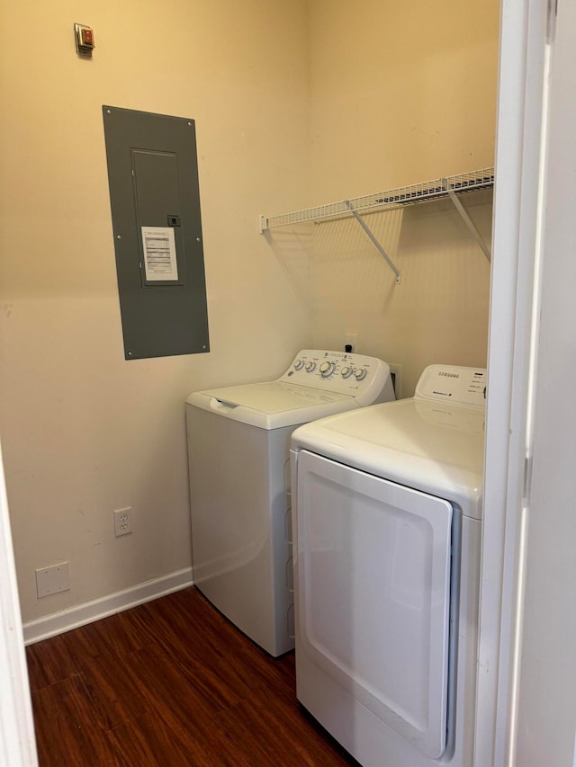 laundry area featuring dark hardwood / wood-style flooring, separate washer and dryer, and electric panel