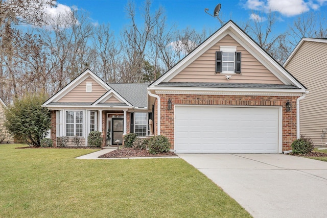 view of front facade with a garage and a front yard