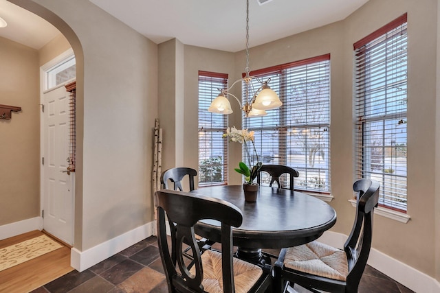 dining area with an inviting chandelier