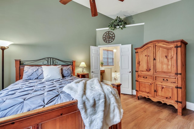 bedroom with light wood-type flooring, ceiling fan, and high vaulted ceiling