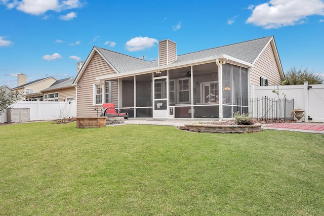 back of property featuring a yard and a sunroom