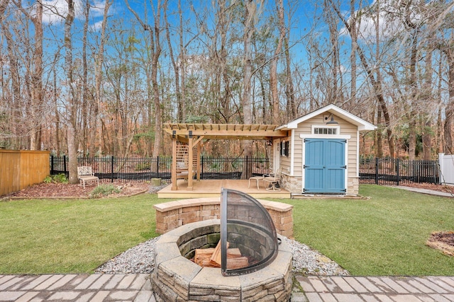 view of yard with a patio area, a fire pit, and a shed