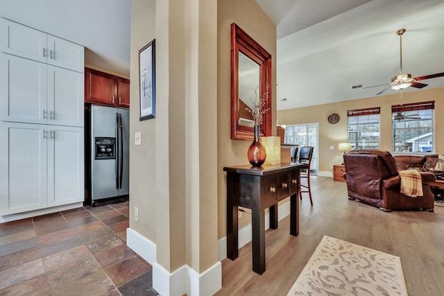 hall with vaulted ceiling