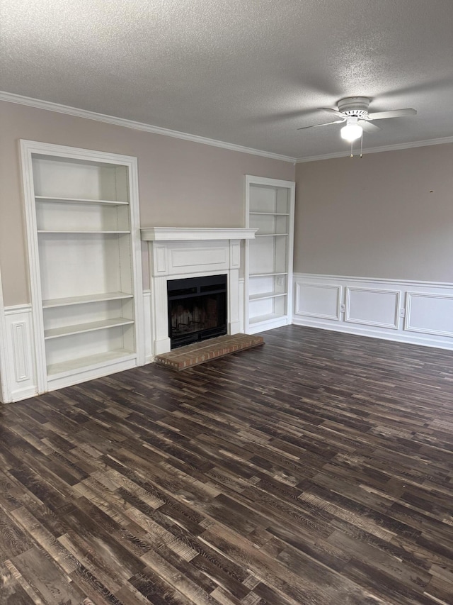 unfurnished living room with built in shelves, dark hardwood / wood-style floors, and a textured ceiling