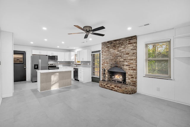 kitchen featuring white cabinets, visible vents, ceiling fan, light countertops, and appliances with stainless steel finishes