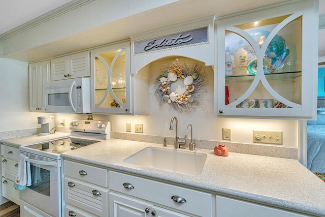 3701 Docksite Rd Unit 220, Edisto Island, SC 29438 - kitchen featuring white appliances, a sink, glass insert cabinets, and light countertops