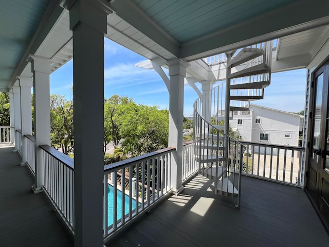 balcony featuring a community pool