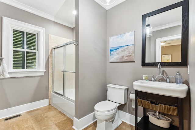 full bathroom featuring crown molding, toilet, tile flooring, vanity, and shower / bath combination with glass door