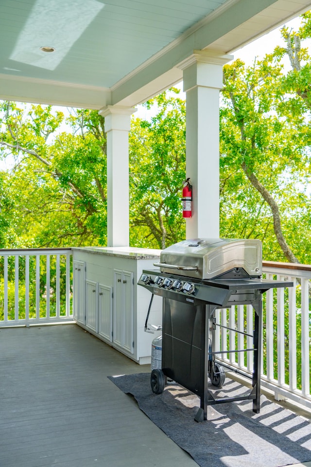 deck featuring a grill