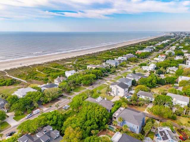 drone / aerial view with a beach view and a water view