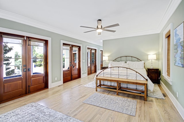 bedroom with french doors, ornamental molding, light hardwood / wood-style flooring, and ceiling fan