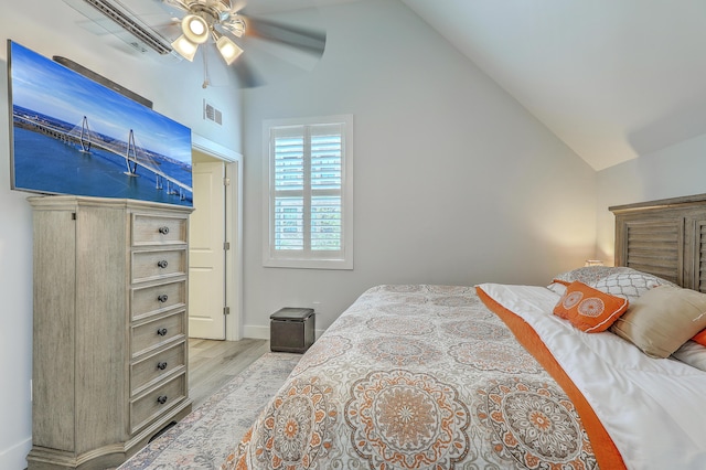 169 Jackson St, Charleston, SC 29403 - bedroom featuring ceiling fan, visible vents, baseboards, wood finished floors, and vaulted ceiling