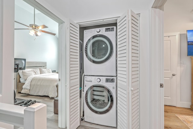 169 Jackson St, Charleston, SC 29403 - laundry area with laundry area, stacked washer and clothes dryer, light wood finished floors, and ceiling fan