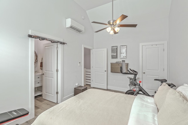 169 Jackson St, Charleston, SC 29403 - bedroom with baseboards, high vaulted ceiling, a wall mounted AC, and wood finished floors