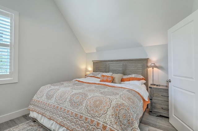 169 Jackson St, Charleston, SC 29403 - bedroom with baseboards, wood finished floors, and vaulted ceiling
