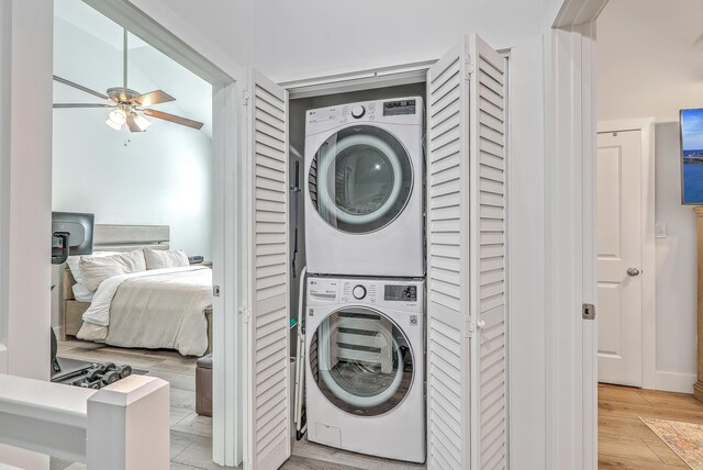 169 Jackson St, Charleston, SC 29403 - laundry area with laundry area, stacked washer and clothes dryer, light wood finished floors, and ceiling fan