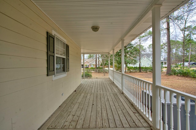 deck featuring a porch and a residential view