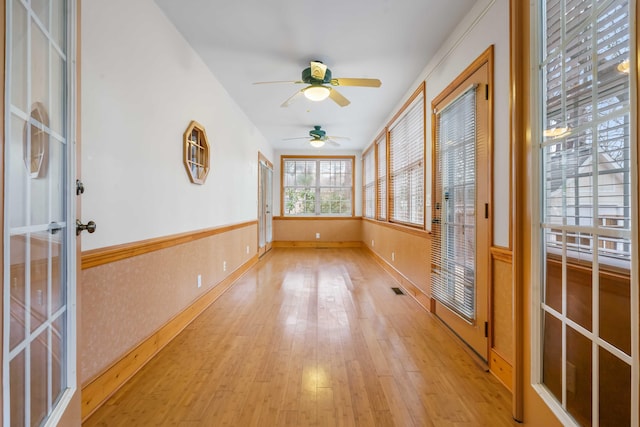 unfurnished sunroom featuring visible vents