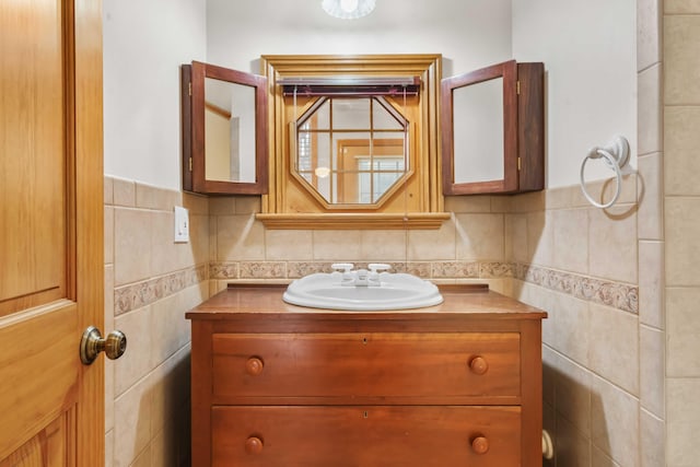 bathroom featuring tile walls and vanity