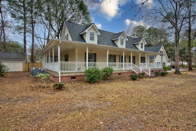 country-style home featuring a porch, roof with shingles, and crawl space