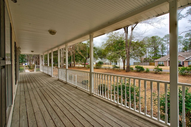 wooden terrace with a residential view